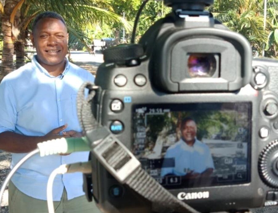 Man standing in front of a camera.
