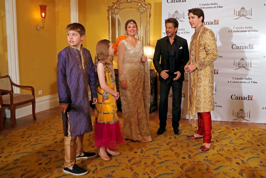 Canadian Prime Minister Justin Trudeau, his wife, daughter and Xavier pose with Bollywood actor Shah Rukh Khan in Mumbai, India.