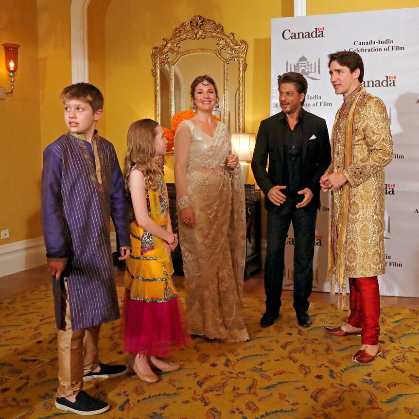Canadian Prime Minister Justin Trudeau, his wife, daughter and Xavier pose with Bollywood actor Shah Rukh Khan in Mumbai, India.