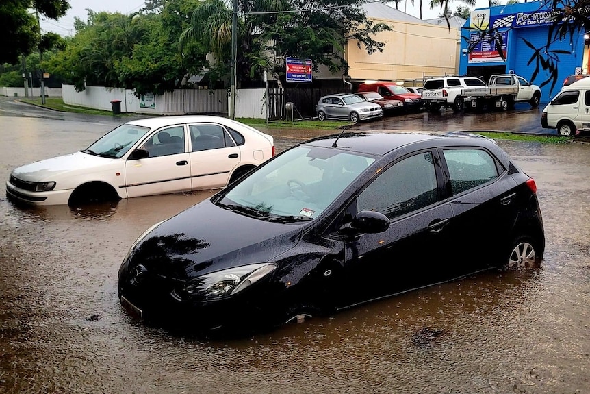 Cars in water up above their tyres.