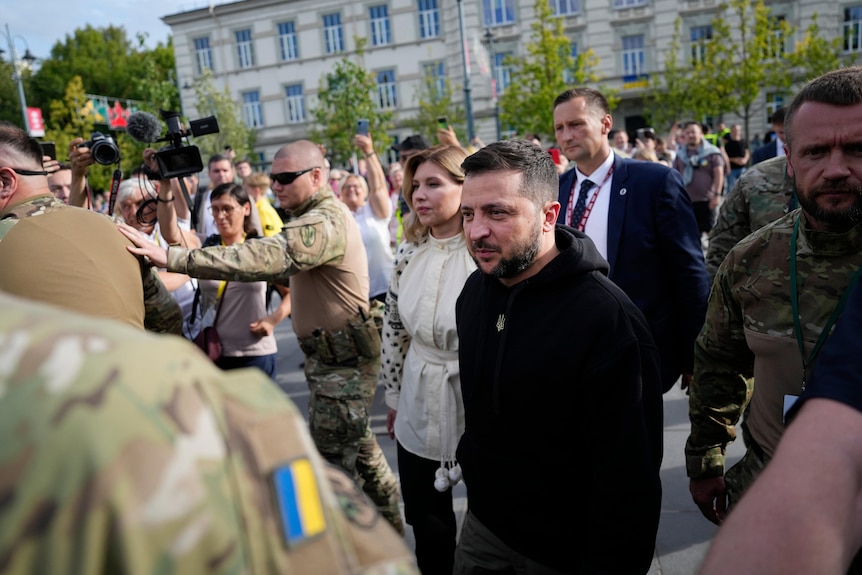 Ukraine's President Volodymyr Zelenskyy, center, arrives for an event on the sidelines of a NATO summit.