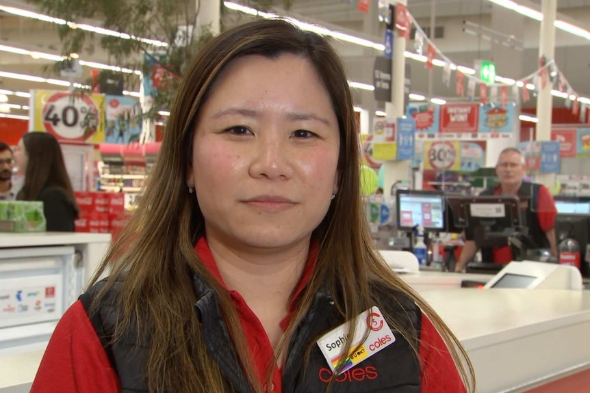 Coles' general manager for SA and NT, Sophie Wong, smiles at the camera as she stands in one of the stores