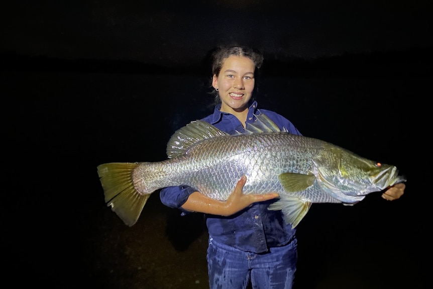 A girl holding a fish