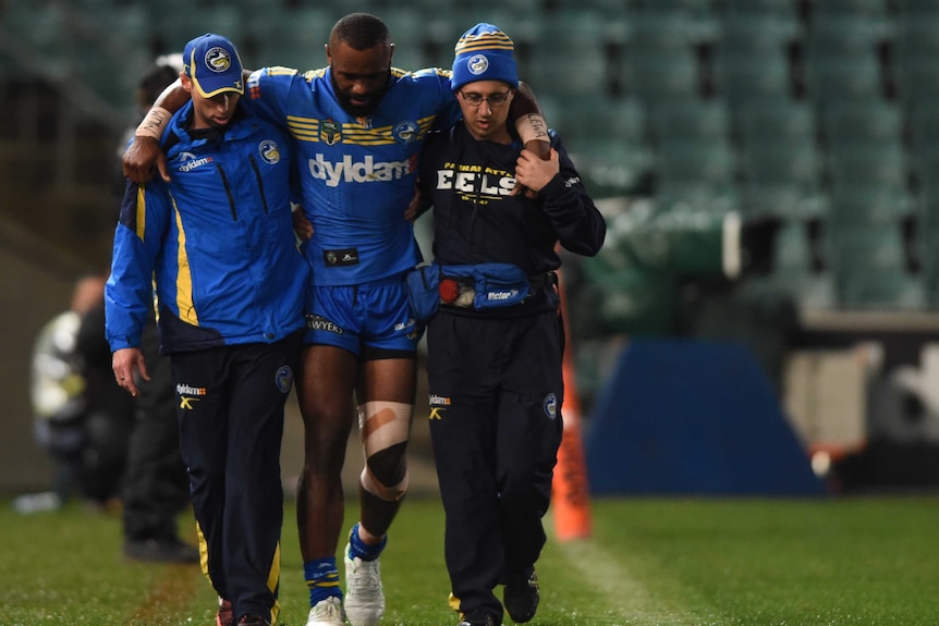 Semi Radradra is helped along the sideline while injured