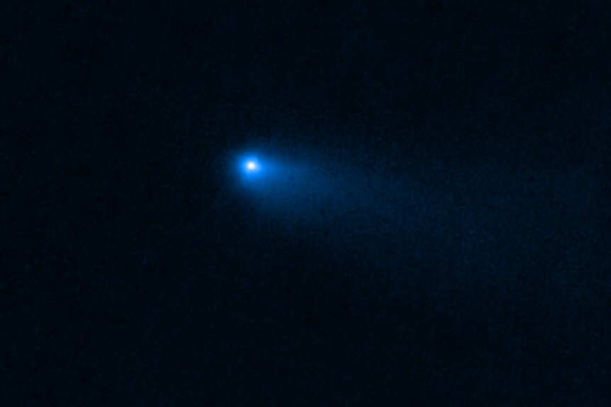 A faint image of a hazy blue dot on a black background.