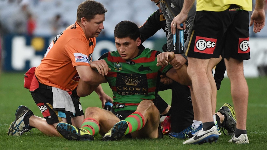 South Sydney's Kyle Turner is attended to after a heavy head knock against Penrith in August 2015.