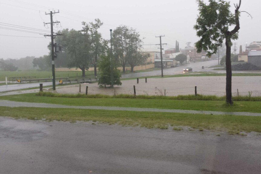 The town of Dungog under heavy rain with some flooded areas.