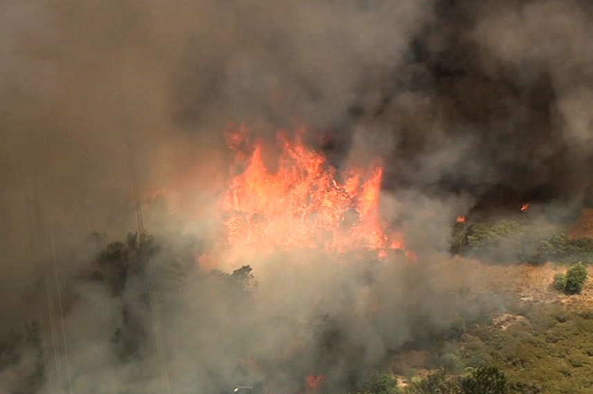 An aerial shot of a big bushfire and lots of smoke.