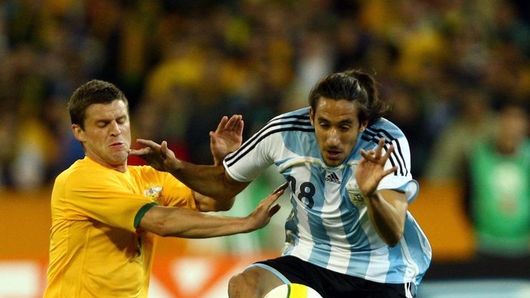 Jason Culina of Australia and Jonas Gutierrez of Argentina during the international friendly.