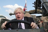 Britain's Foreign Secretary Boris Johnson talks during a ceremony at the Tomb of the Unknown Soldier in Warsaw, Poland