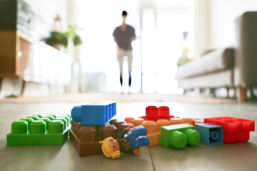 Lego and various other toys on a wooden floor