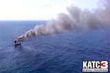 Smoke pours from an offshore oil platform in the Gulf of Mexico