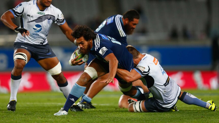 Steven Luatua of the Blues is tackled by the Western Force in their round 12 Super Rugby game.
