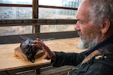 Artist David Hurst working on his wax tiger head.