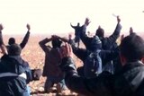 Algeria's Ennahar TV shows hostages surrendering to Islamist gunmen who overtook a remote gas facility.