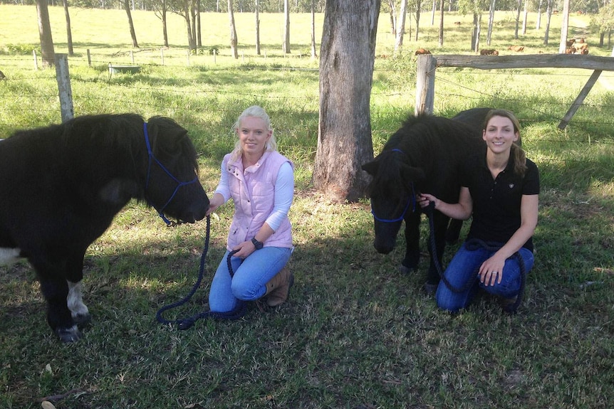 (LtoR) QUT stable manager Lisa Clancy and QUT veterinarian Dr Alexandra Meiers