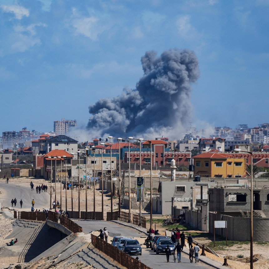Smoke rises following an Israeli airstrike in the central Gaza Strip, Friday, March 15, 2024.