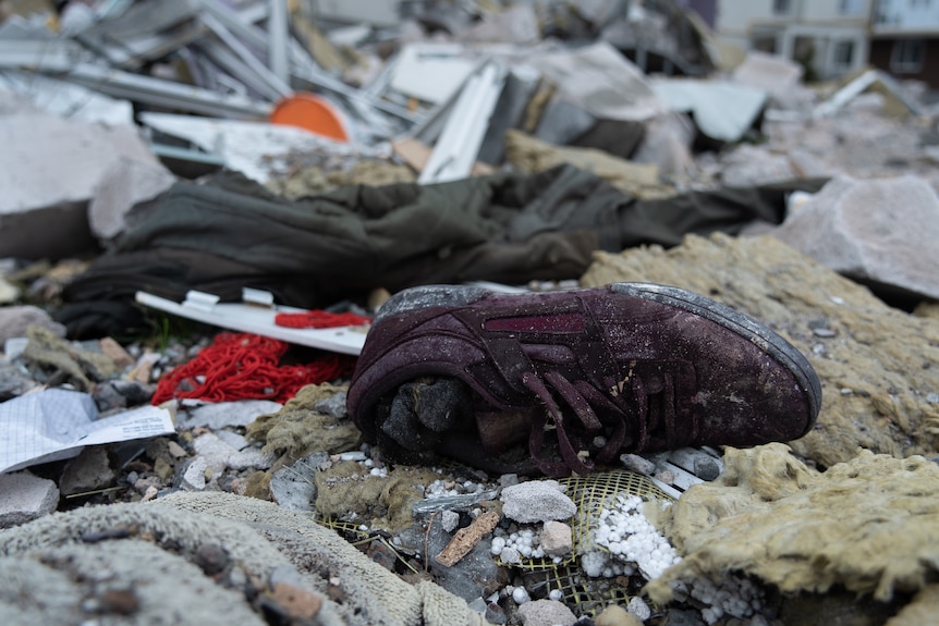 A purple runner surrounded by other rubble.