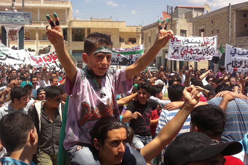 Demonstrators march against Bashar Al Assad in Binsh, near the northern province of Idlib.