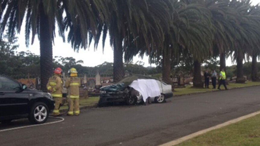 A mourner has been killed and her husband injured in a freak car accident at a Sydney cemetery, June 20, 2014
