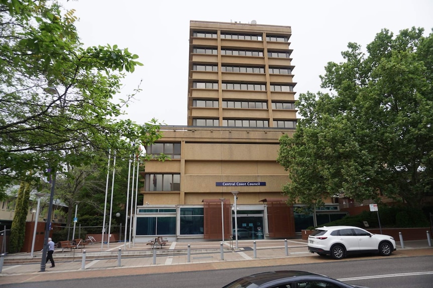 A wide shot of the sandy-coloured Central Coast Council building in Gosford