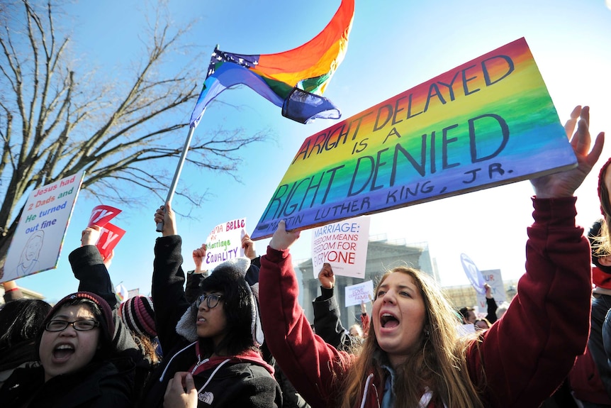 Gay marriage supporters rally outside the US Supreme Court