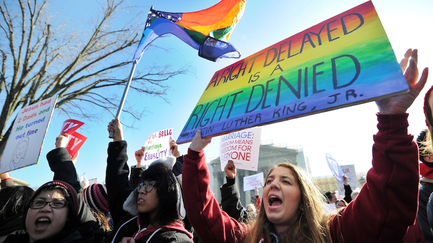 Gay marriage supporters rally outside the US Supreme Court