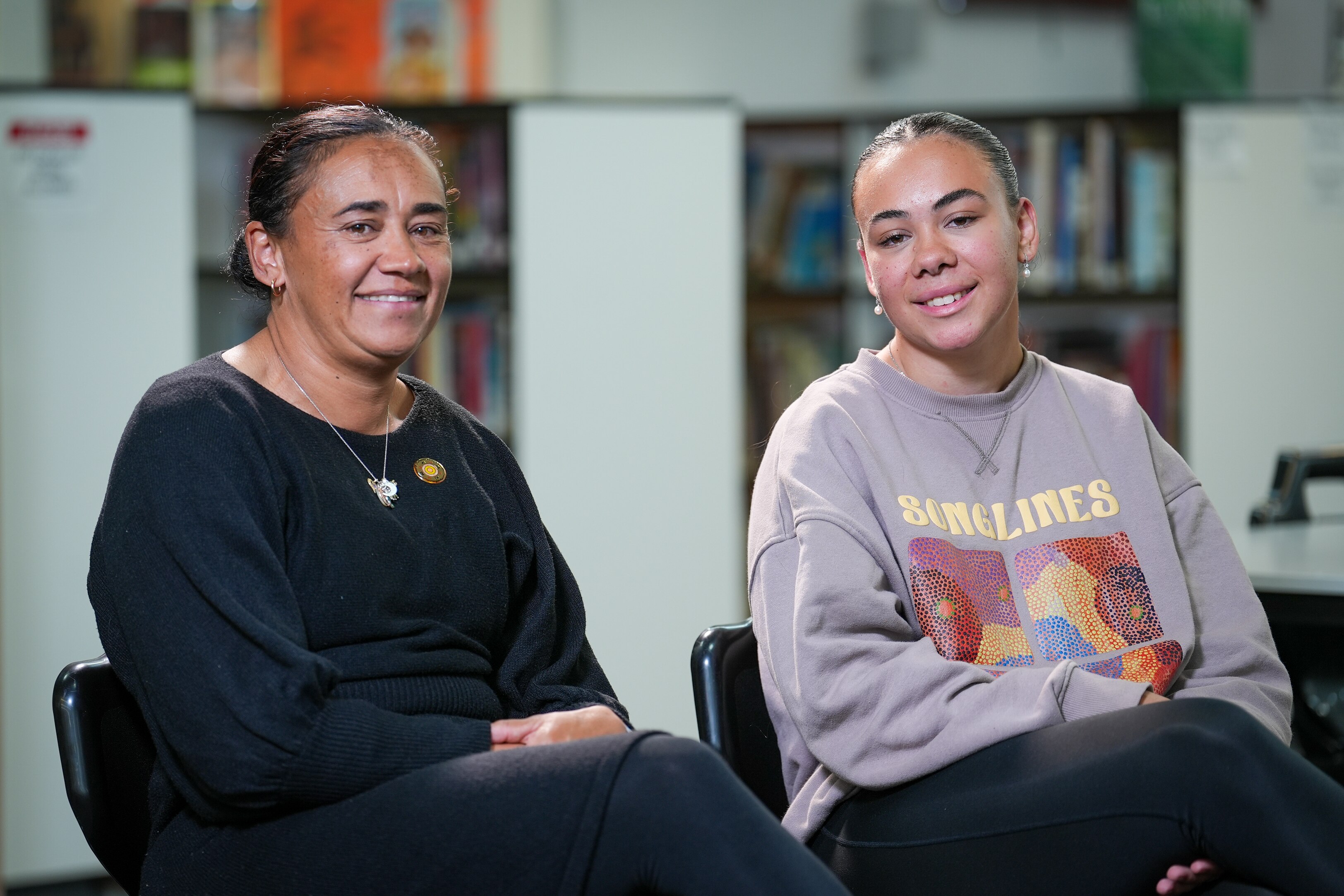 Teacher Jenadel Lane sits with her daughter Retori.