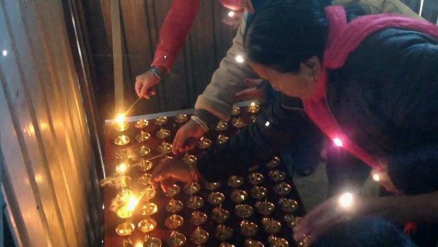 People light small candles