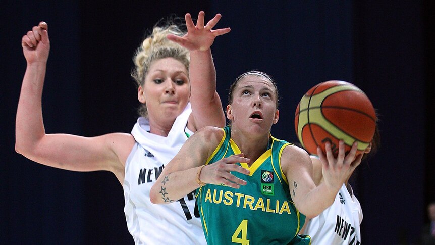 London here we come ... Australia's Natalie Hurst drives past New Zealand defender Rebecca Dew.