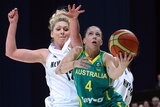 London here we come ... Australia's Natalie Hurst drives past New Zealand defender Rebecca Dew.