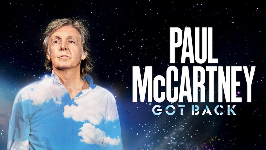 Paul McCartney in a blue and white shirt against a starry background