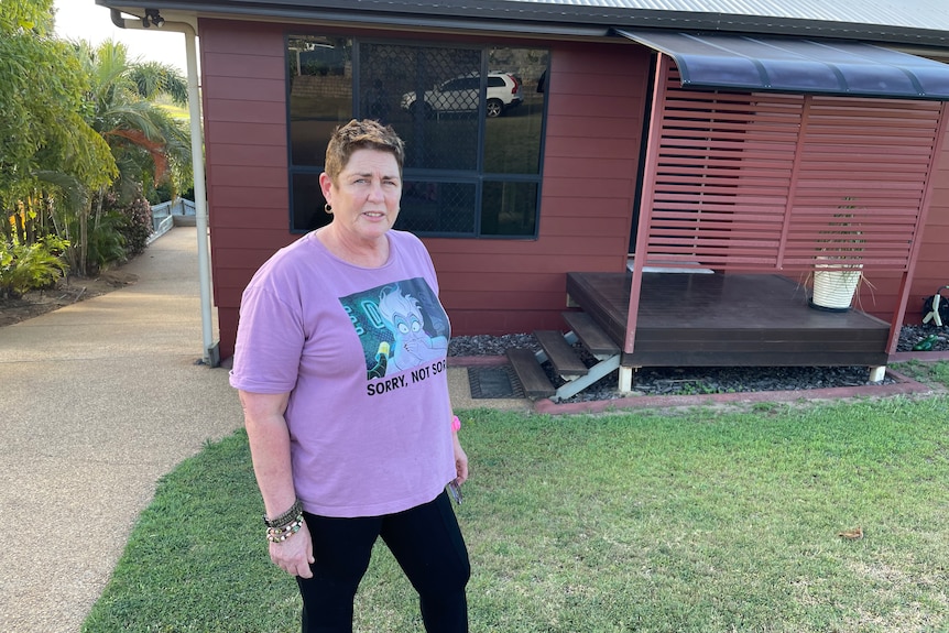 Amanda Baker outside her Yeppoon home where she has just increased building cover to $600,000.