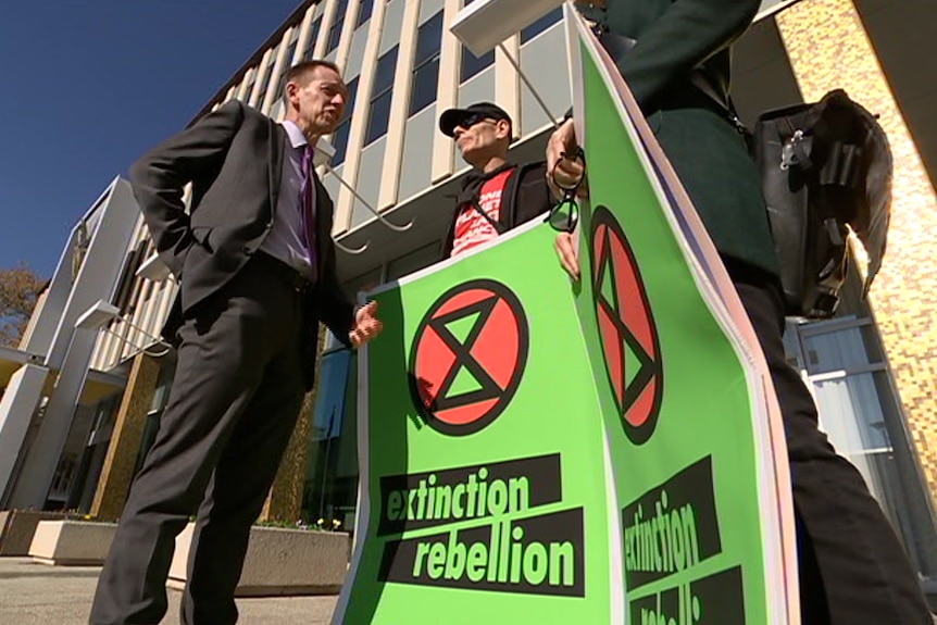 Protestors from an Australian offshoot of Extinction Rebellion at a press conference.