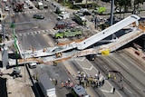 This photo provided by DroneBase shows the collapsed pedestrian bridge at Florida International University in the Miami area.