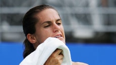 Amelie Mauresmo takes a break during her first-round loss to Ana Ivanovic