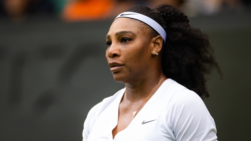 Serena Williams looks with a neutral expression on her face