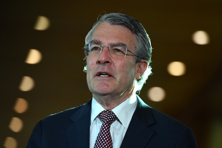 A close up shot of Mark Dreyfus wearing a suit and tie. 