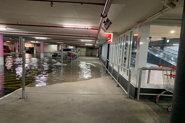 A flooded car park at Garden City shopping centre in Mount Gravatt.