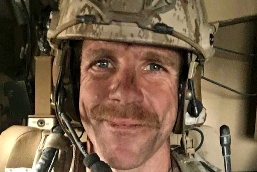 Edward Gallagher selfie in camouflage helmet and microphone.