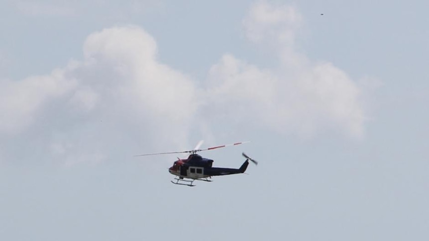 A resecue helicopter joined the search for the alleged armed robber