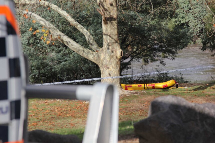 An inflatable kyak in an area roped off by search and rescue teams by the cotter