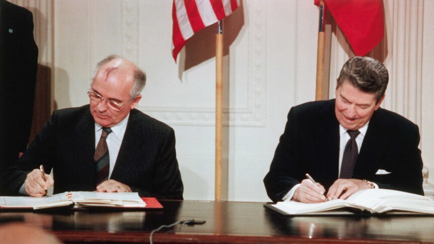 Ronald Reagan signs a treaty with the Soviet Union in 1987