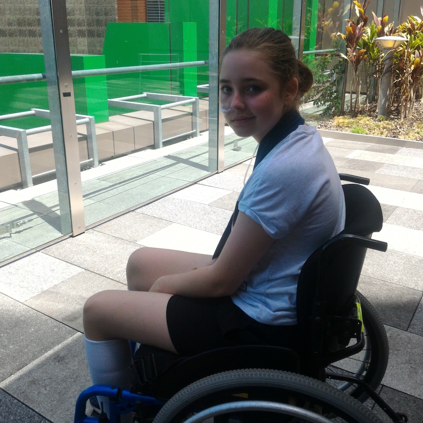 A girl in a wheelchair