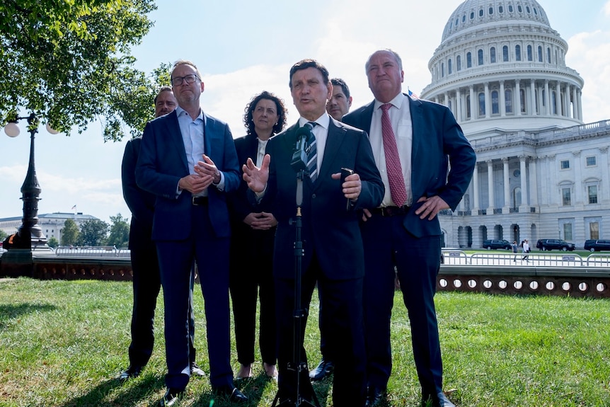 The six parliamentarians stand in front of the Capitol building for a press conference. Tony Zappia is speaking.