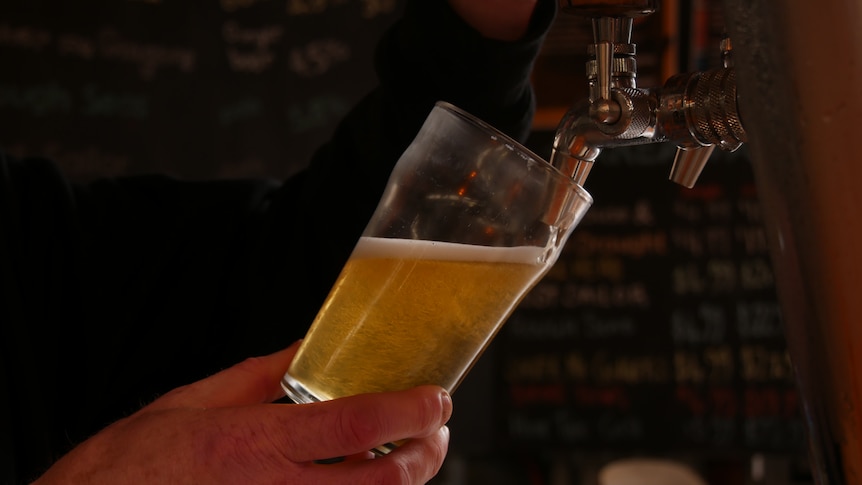 Pouring a pint of beer on tap at the pub