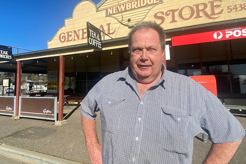 man outside his general store