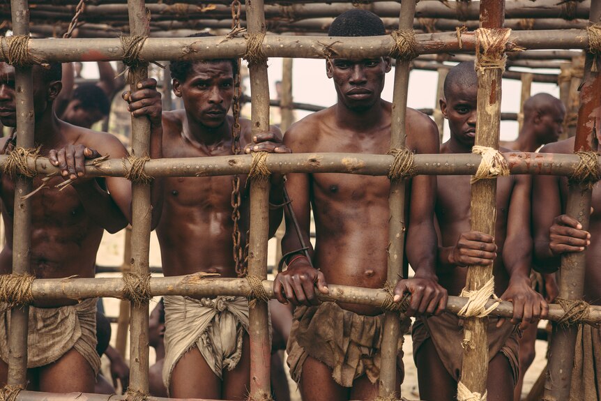 Caged African American men.