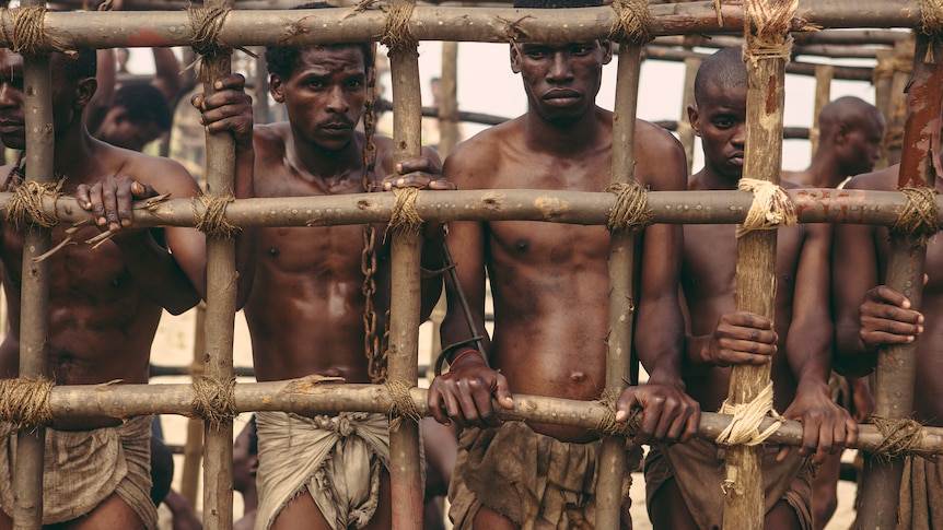 African American men inside a cell.