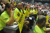 Union members hold up np fracking signs during Michael Gunner's speech.